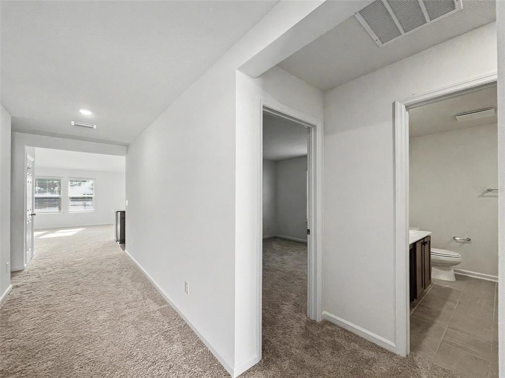 55 Signet Circle Flagler Beach, FL 32136 - Photo 28 of 39 a view of a room with an empty space and wooden floor