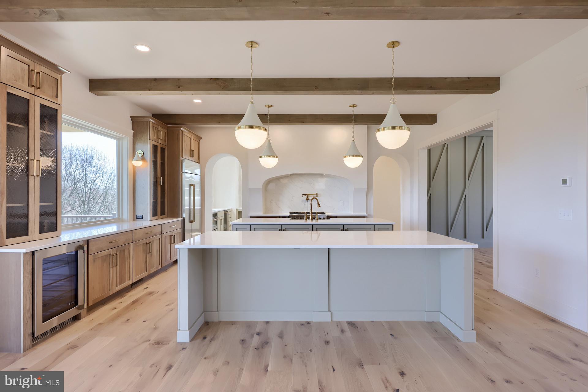 1233 Hunsicker Road Lancaster, PA 17601 - Photo 11 of 23 a large kitchen with a lot of counter space and wooden floor