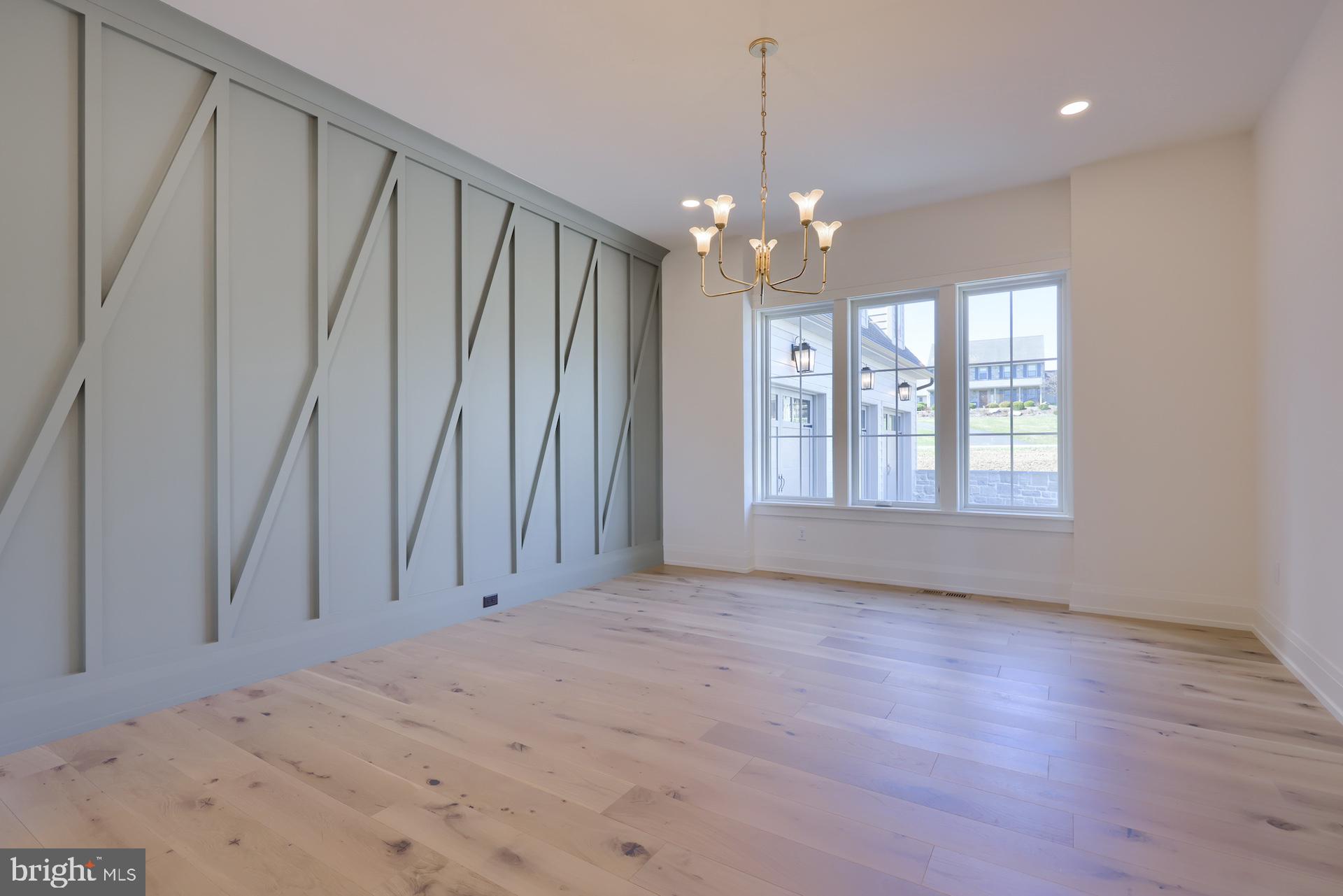 1233 Hunsicker Road Lancaster, PA 17601 - Photo 4 of 23 a view of an empty room with a window and wooden floor