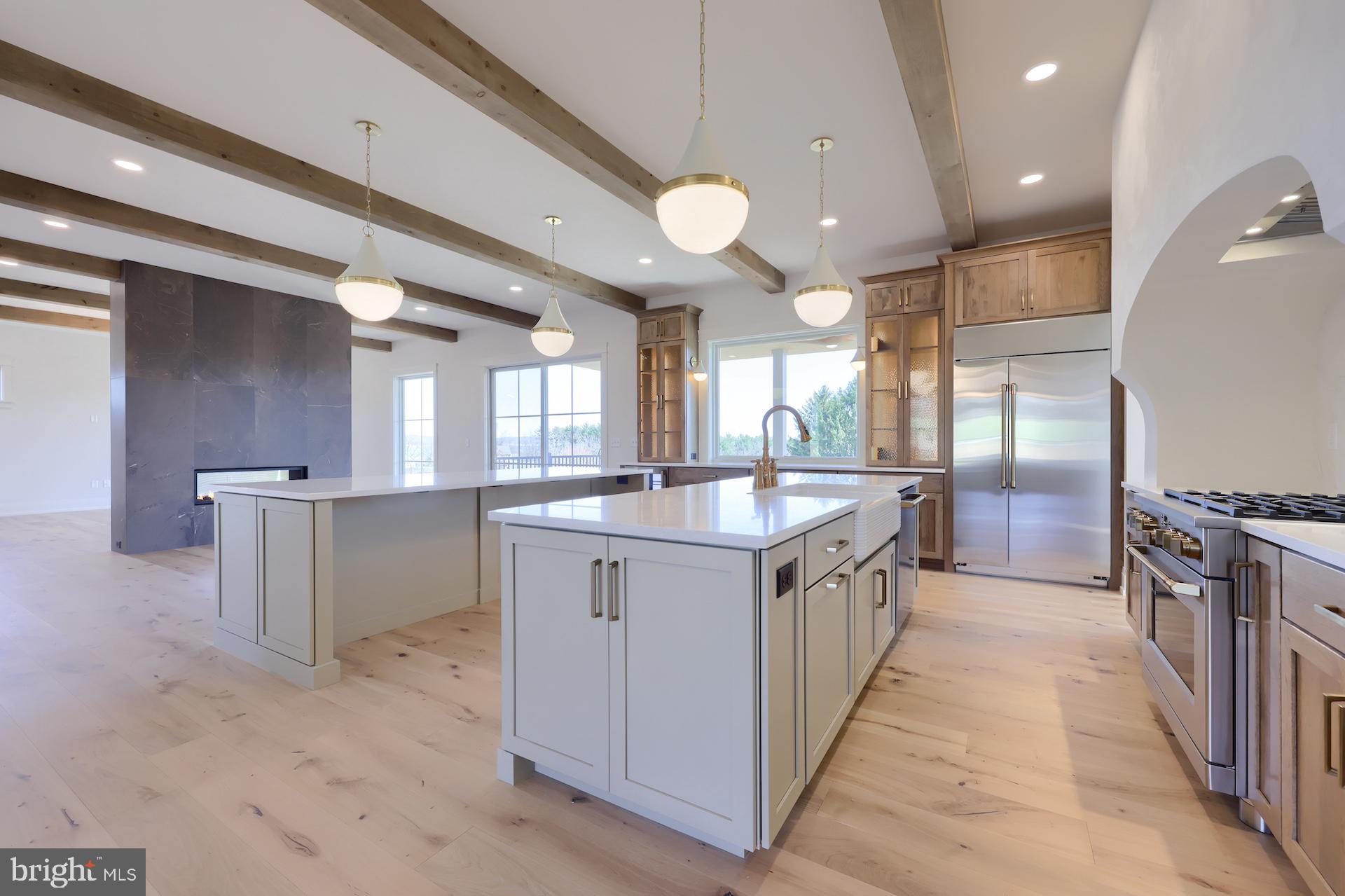 1233 Hunsicker Road Lancaster, PA 17601 - Photo 7 of 23 a large kitchen with a large counter top sink and stainless steel appliances