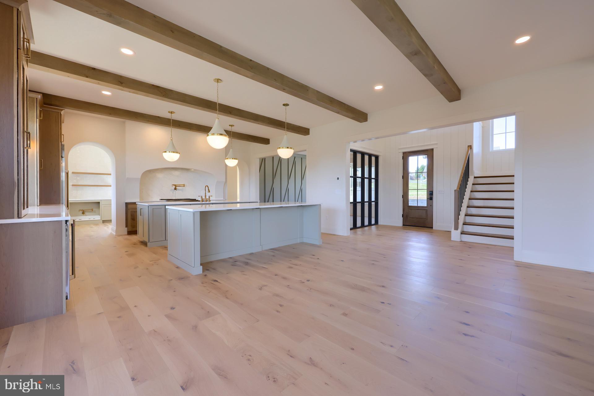 1233 Hunsicker Road Lancaster, PA 17601 - Photo 10 of 23 a view of a big room with wooden floor and a kitchen