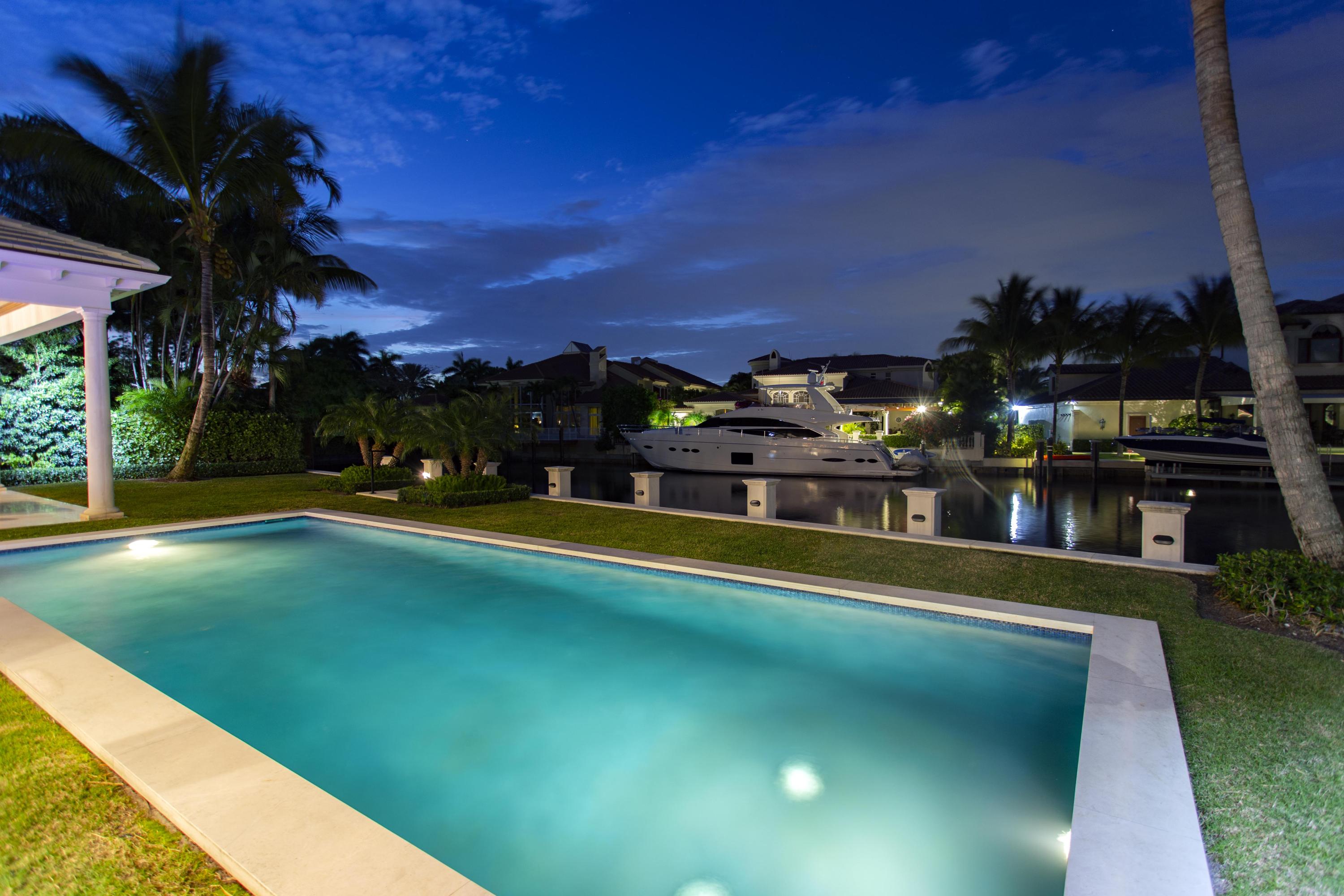 651 Northeast 45th Road Boca Raton, FL 33431 - Photo 19 of 23 a view of a swimming pool with a yard