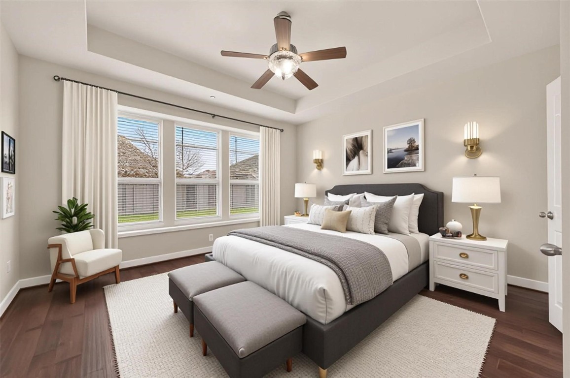 107 Angel Hollow Lane Rosenberg, TX 77469 - Photo 15 of 50 Virtually staged to show off its true potential, this primary suite proves there’s plenty of room for a king-sized setup and a quiet reading corner. (Virtual staging)