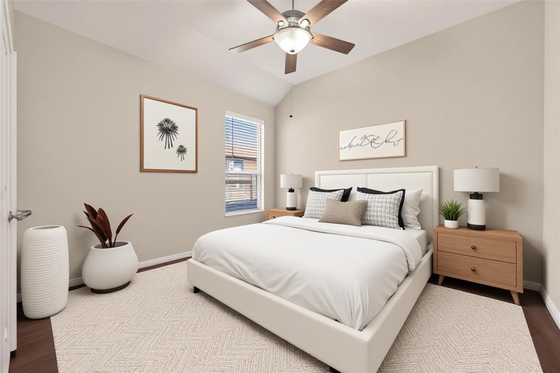 107 Angel Hollow Lane Rosenberg, TX 77469 - Photo 31 of 50 Another generous bedroom featuring wood floors and a steady breeze overhead, following the cohesive design of the rest of the home. (Virtual staging)