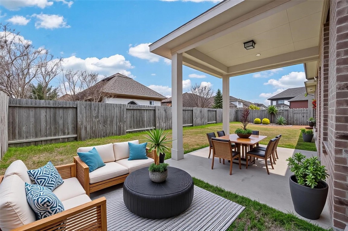 107 Angel Hollow Lane Rosenberg, TX 77469 - Photo 37 of 50 Virtually staged to show its entertaining possibilities, this outdoor space is just waiting for a grill, some string lights, and a long weekend. (Virtual staging)