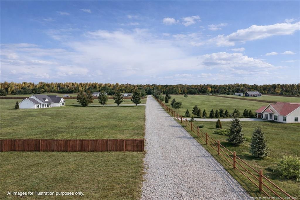 0 Paddock Meadows Red Springs, NC 28377 - Photo 29 of 29 a view of a lake with houses in the back