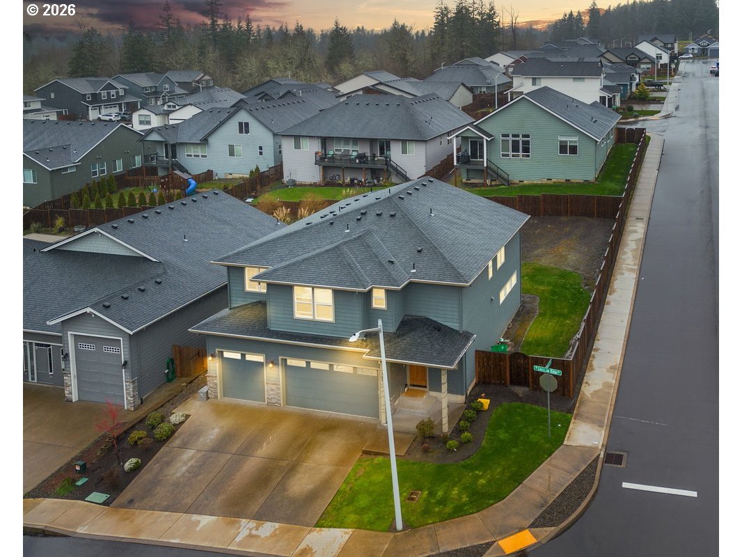 an aerial view of a house with swimming pool
