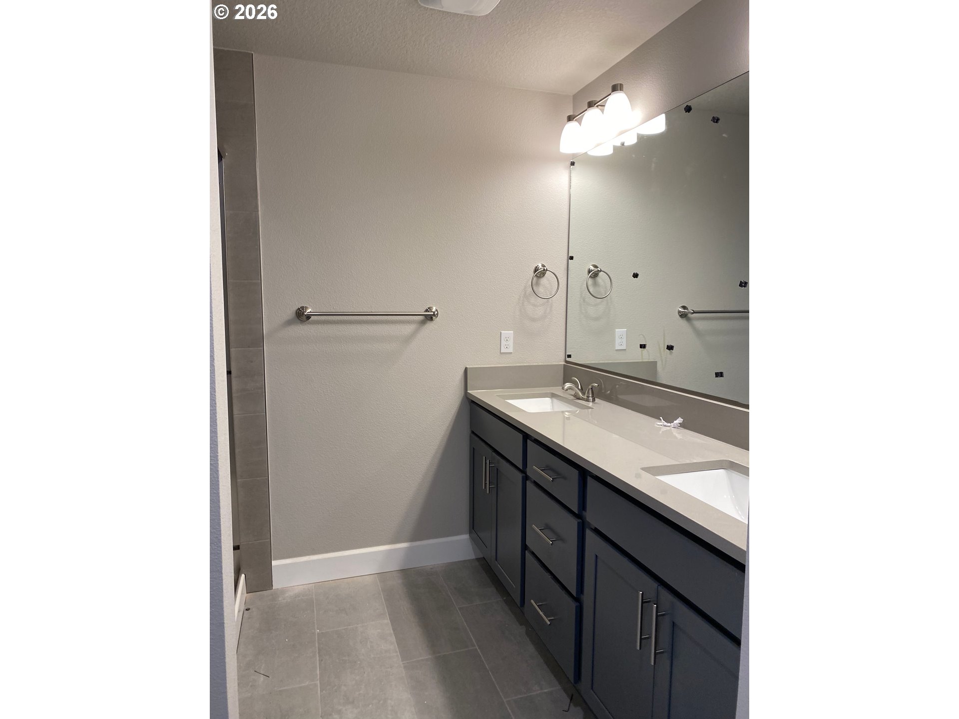 1729 Northeast Cascadia Ridge Drive Estacada, OR 97023 - Photo 16 of 19 a bathroom with a sink and a mirror