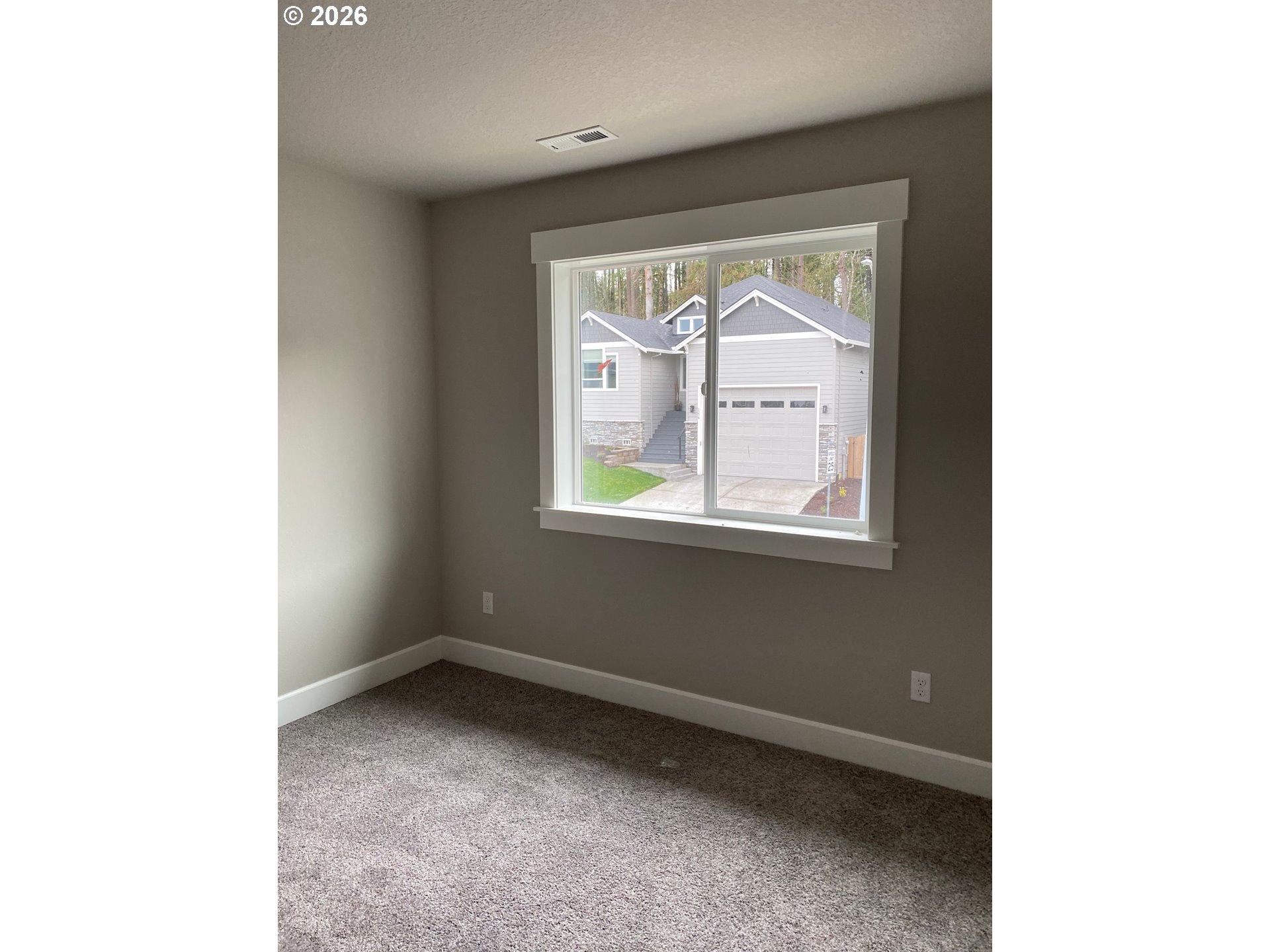 1729 Northeast Cascadia Ridge Drive Estacada, OR 97023 - Photo 19 of 19 a view of an empty room with a window