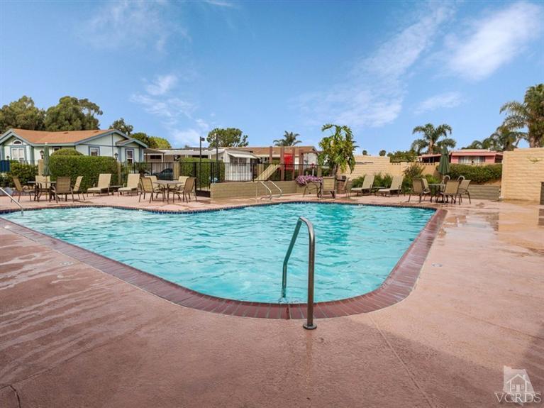 2400 East Pleasant Valley Road, Unit 136 Oxnard, CA 93033 - Photo 13 of 16 a view of a swimming pool with a yard