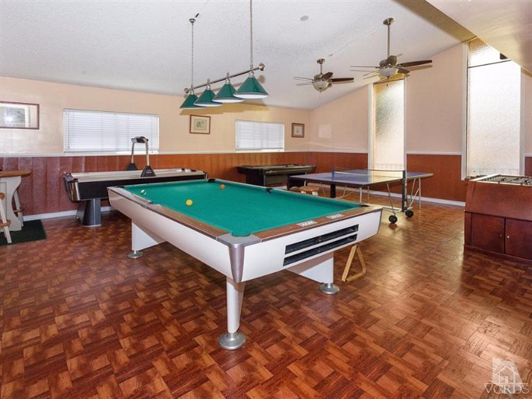 2400 East Pleasant Valley Road, Unit 136 Oxnard, CA 93033 - Photo 15 of 16 a room with pool table table tennis pool table and windows