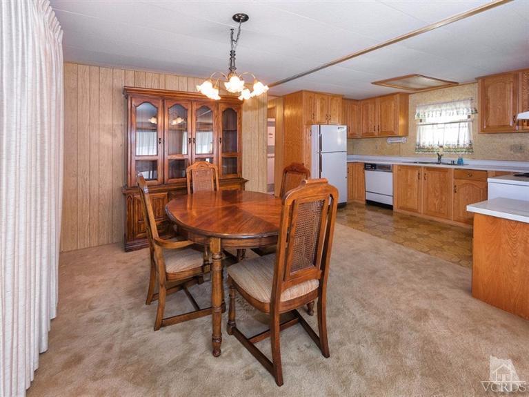 2400 East Pleasant Valley Road, Unit 136 Oxnard, CA 93033 - Photo 3 of 16 a view of a dining room with furniture window and outside view