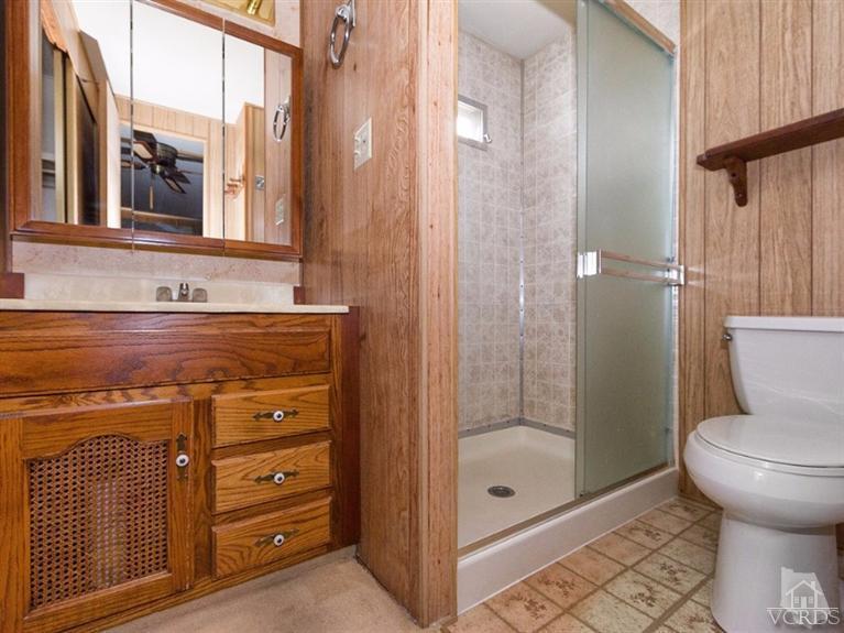 2400 East Pleasant Valley Road, Unit 136 Oxnard, CA 93033 - Photo 5 of 16 a bathroom with a shower a toilet and a sink