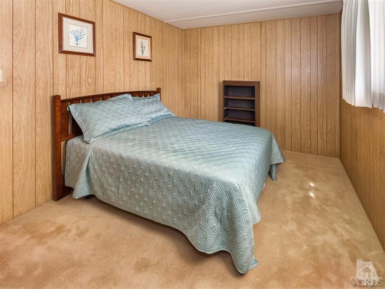 2400 East Pleasant Valley Road, Unit 136 Oxnard, CA 93033 - Photo 8 of 16 a bedroom with a bed and a tv