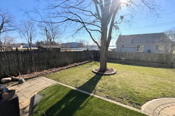 a view of a backyard with swimming pool