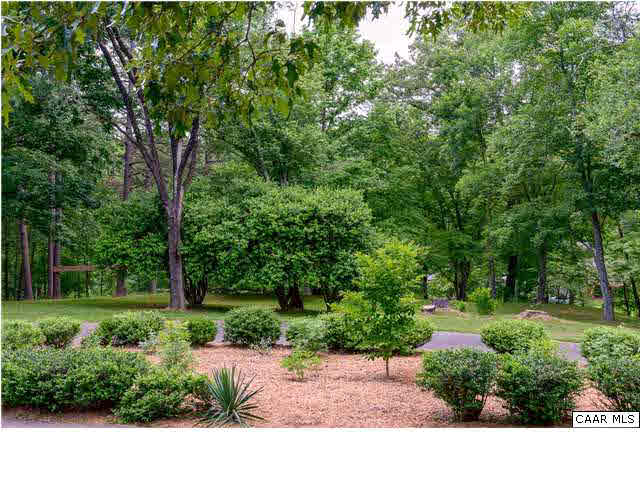 6568 Plank Road Afton, VA 22920 - Photo 5 of 34 a view of a garden with a bench in front of the house