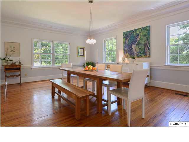 6568 Plank Road Afton, VA 22920 - Photo 7 of 34 a dining room with wooden floor a chandelier a wooden table and chairs
