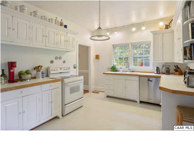 6568 Plank Road Afton, VA 22920 - Photo 8 of 34 a kitchen with a sink cabinets stainless steel appliances and a window