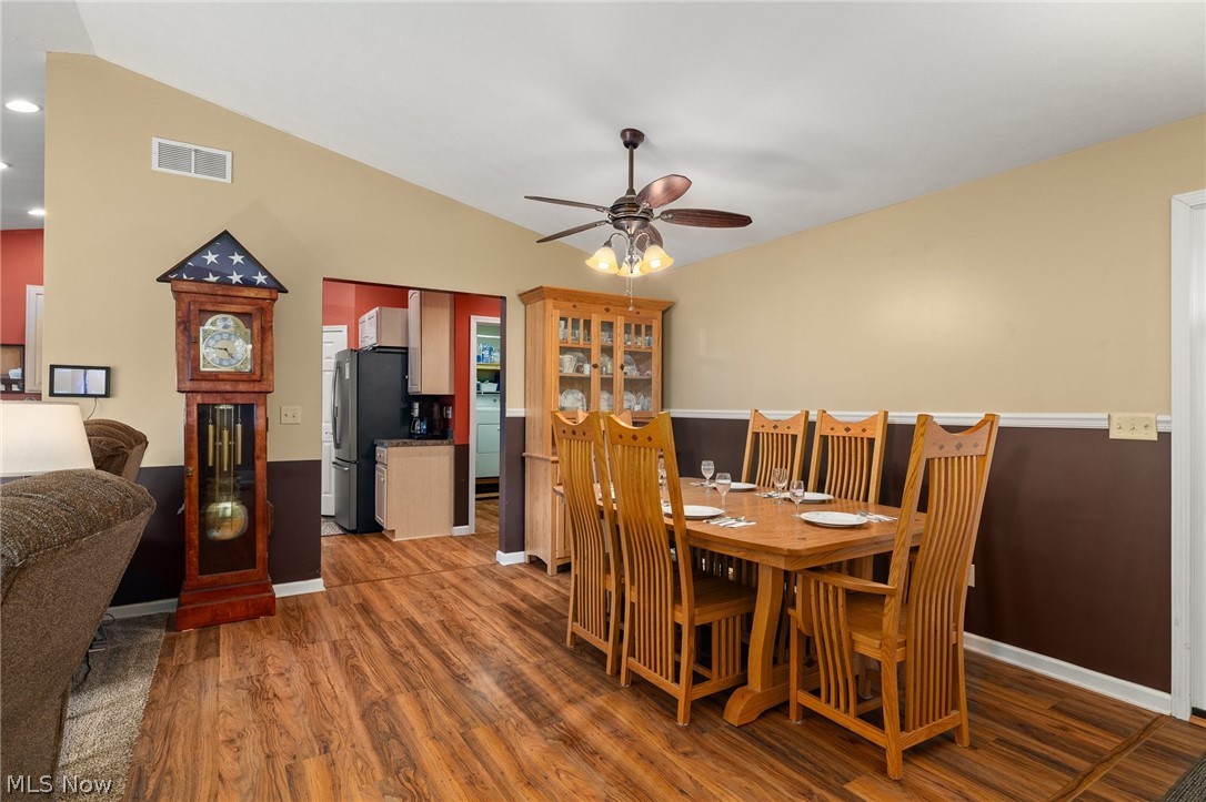2335 South Funk Road Wooster, OH 44691 - Photo 10 of 47 Dining space featuring ceiling fan, vaulted ceiling, and hardwood / wood-style floors