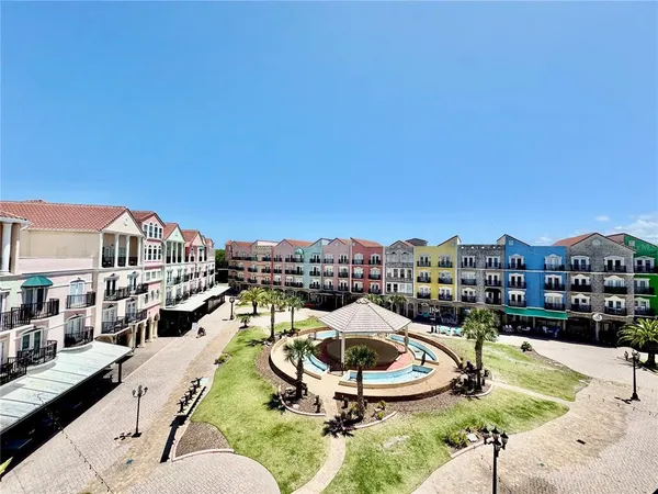 a view of a building with a yard