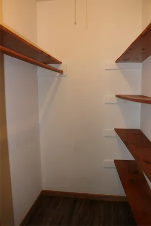 a view of small space with empty racks on the wall