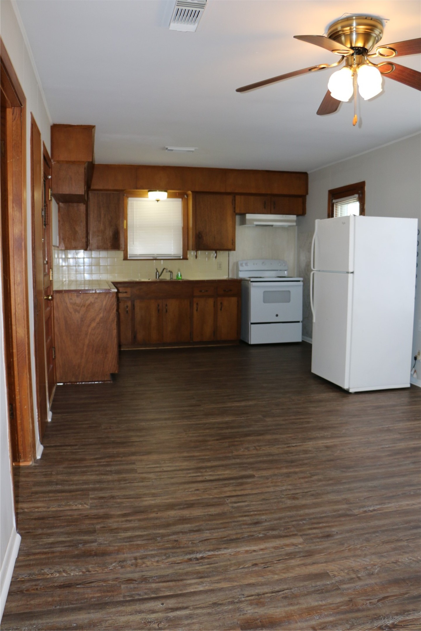 710 West 7th Street Freeport, TX 77541 - Photo 14 of 20 a view of room with cabinets and wooden floor
