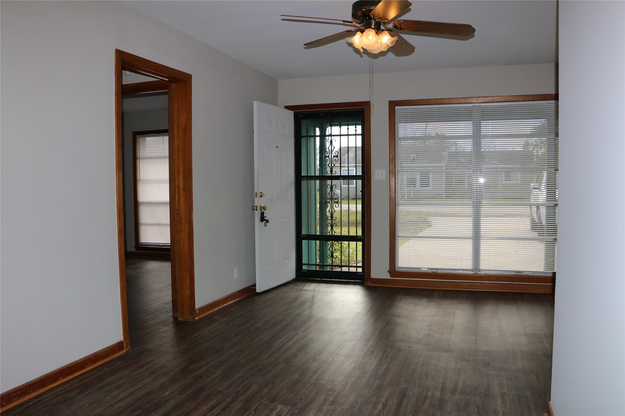 710 West 7th Street Freeport, TX 77541 - Photo 18 of 20 wooden floor in an empty room with a window