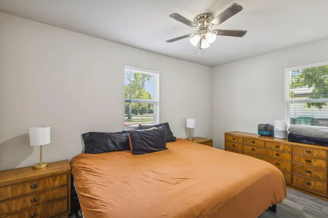 a bedroom with a bed and window