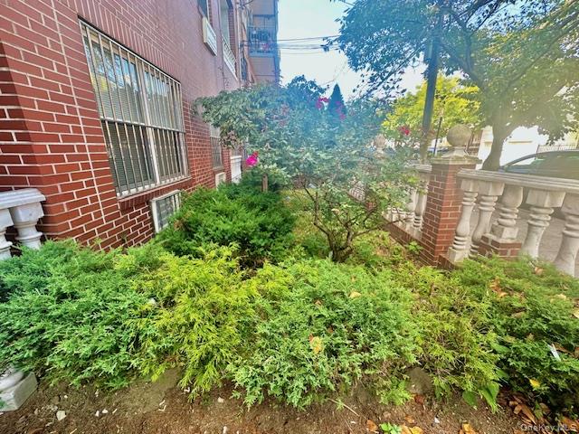 104-48 37th Drive, Unit 3A Queens, NY 11368 - Photo 12 of 17 a view of a house with a garden