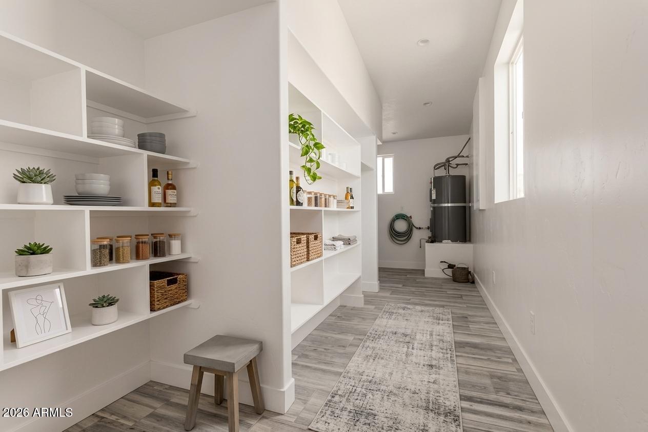 317 West Frontier Street Apache Junction, AZ 85120 - Photo 12 of 14 a view of a hallway with workspace and a window