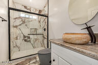317 West Frontier Street Apache Junction, AZ 85120 - Photo 13 of 14 a bathroom with a granite countertop sink mirror and toilet