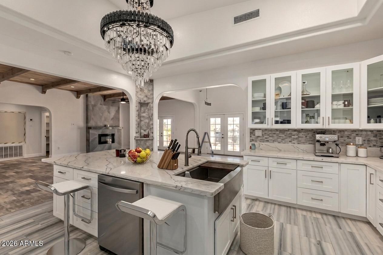317 West Frontier Street Apache Junction, AZ 85120 - Photo 4 of 14 a kitchen with stainless steel appliances a sink stove and cabinets