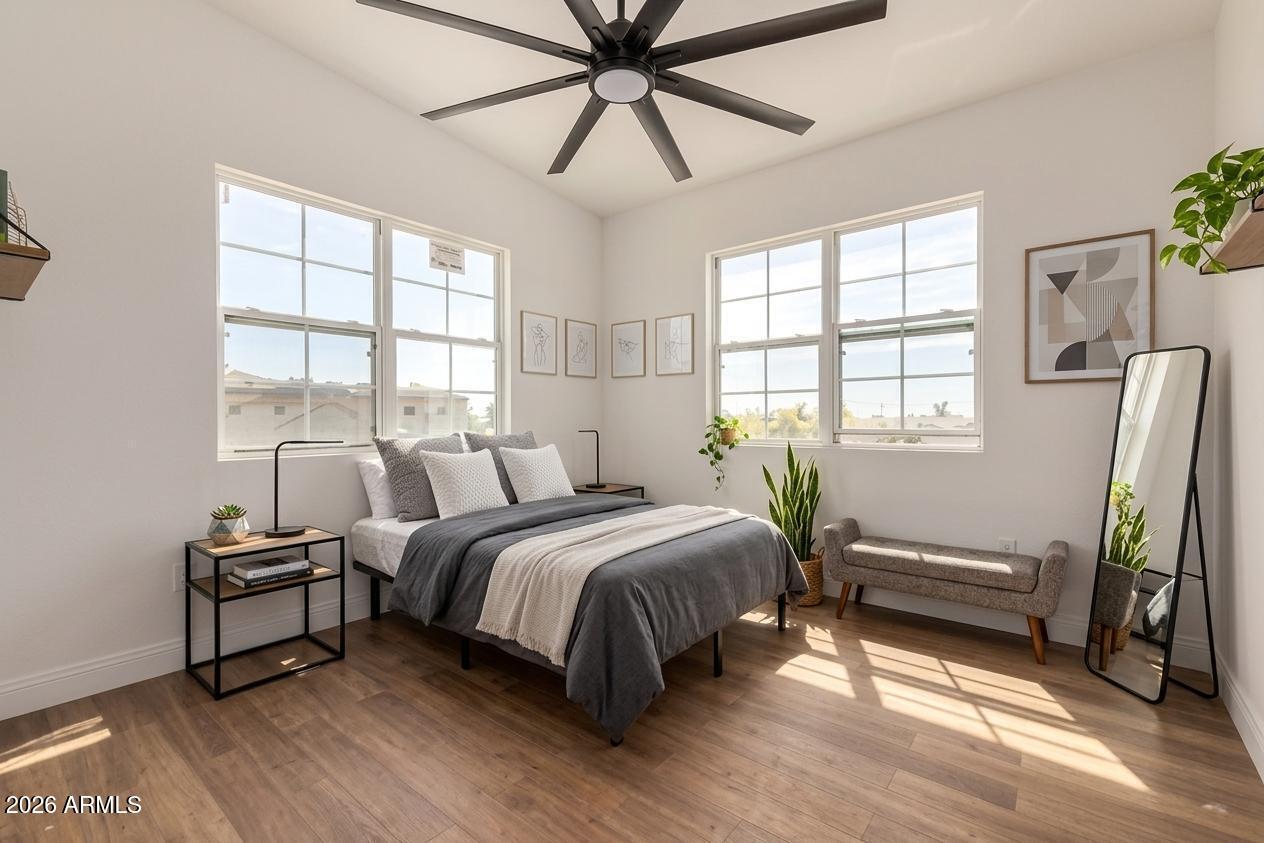317 West Frontier Street Apache Junction, AZ 85120 - Photo 7 of 14 a bedroom with a bed and a chandelier