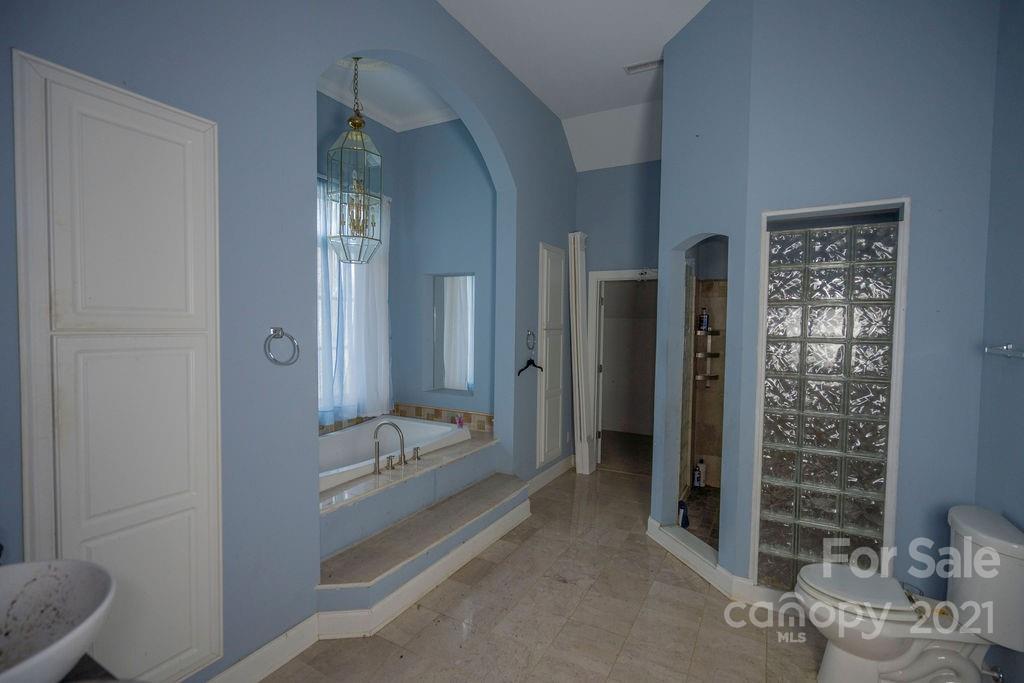 577 Crousetown Road Lexington, NC 27292 - Photo 21 of 39 a spacious bathroom with a shower and a sink