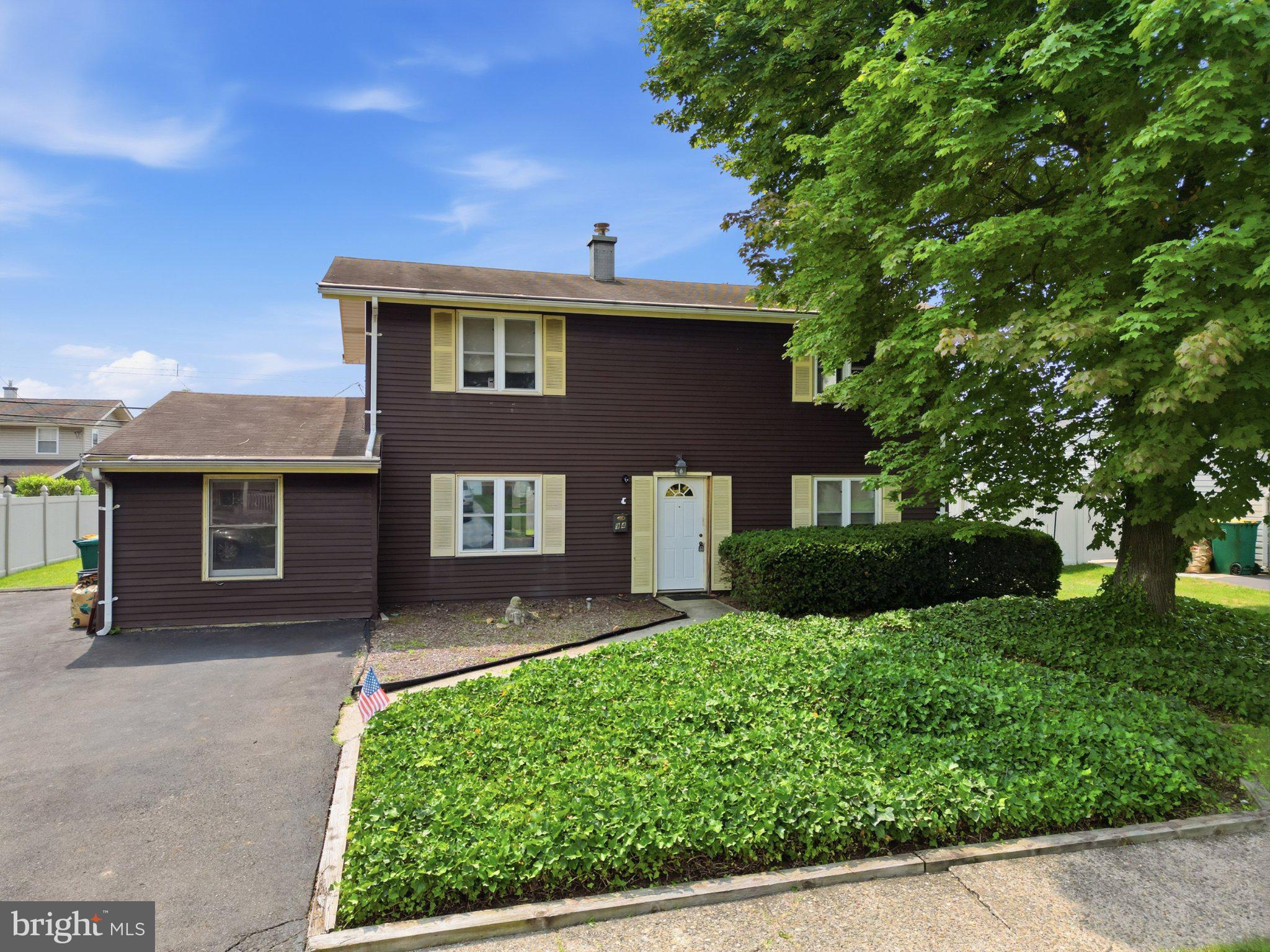 94 Terrace Road Levittown, PA 19056 - Photo 6 of 70 Charming two-story home with lush greenery.