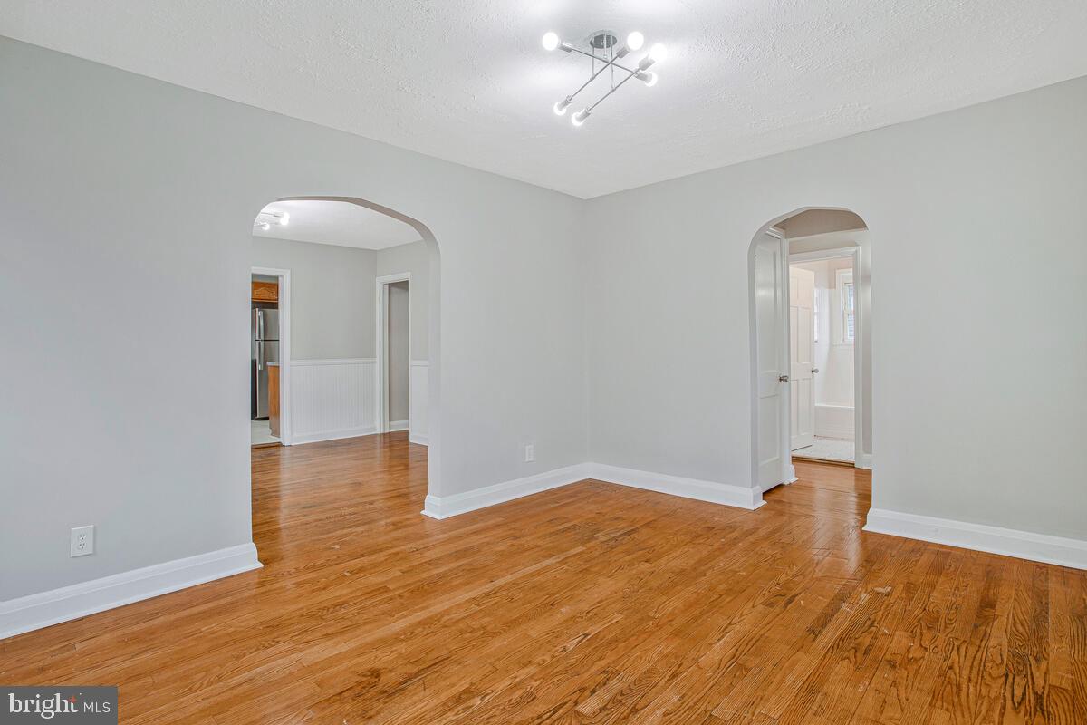 119 West Edgevale Road Baltimore, MD 21225 - Photo 11 of 37 a view of empty room with wooden floor
