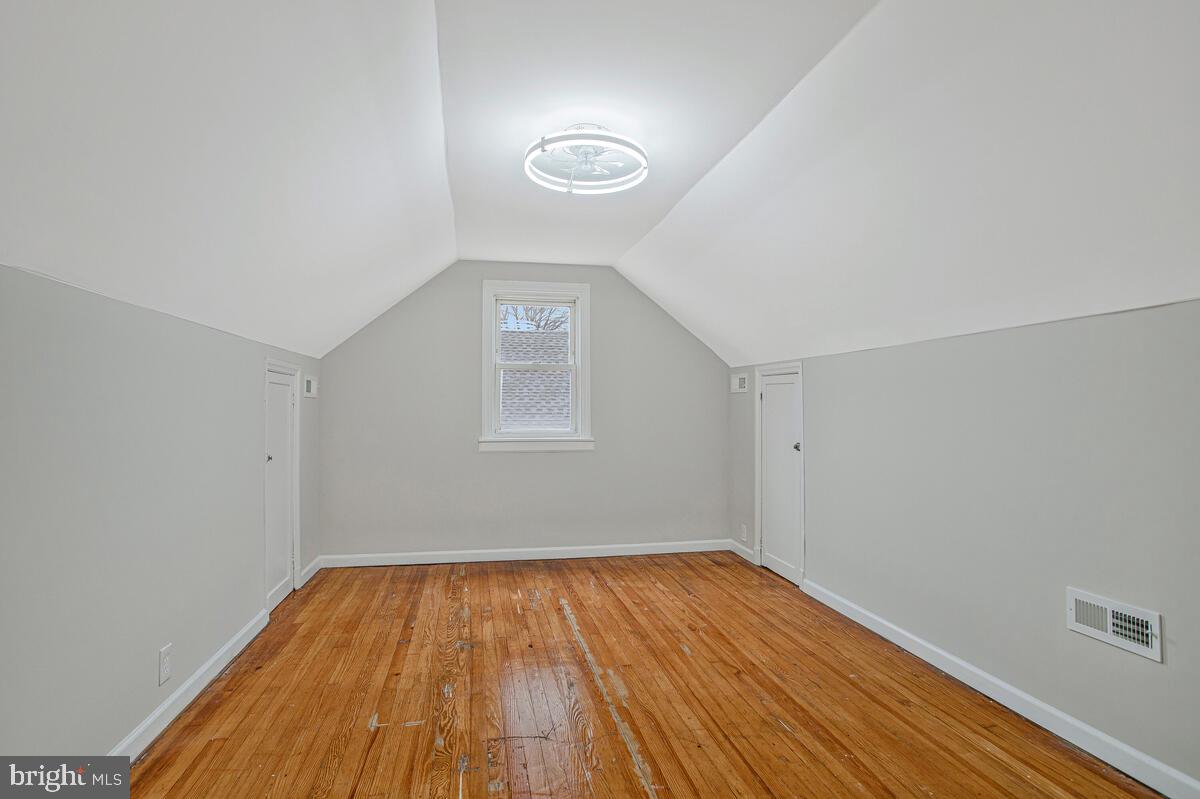 119 West Edgevale Road Baltimore, MD 21225 - Photo 22 of 37 wooden floor in an empty room with a window