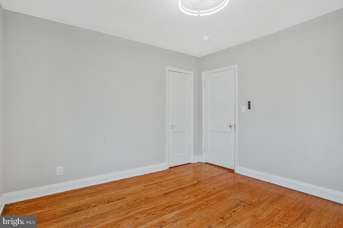 119 West Edgevale Road Baltimore, MD 21225 - Photo 23 of 37 a view of empty room with wooden floor