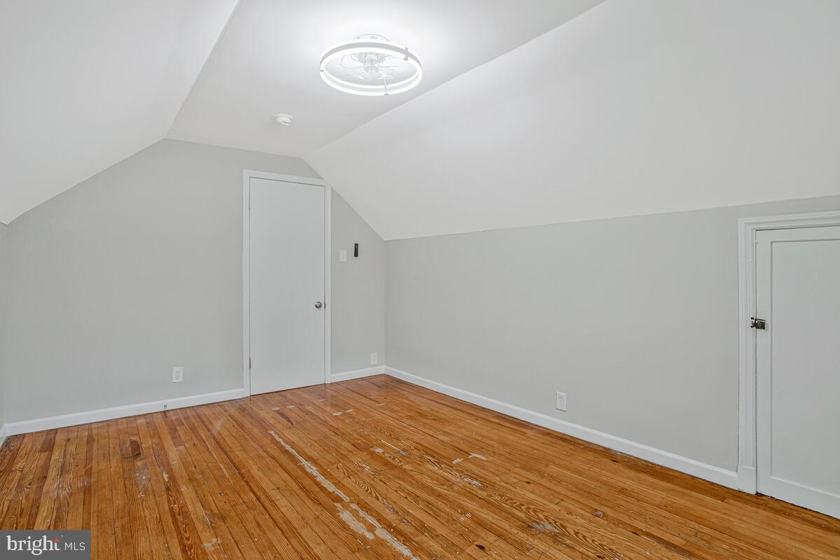 119 West Edgevale Road Baltimore, MD 21225 - Photo 25 of 37 a view of empty room with wooden floor