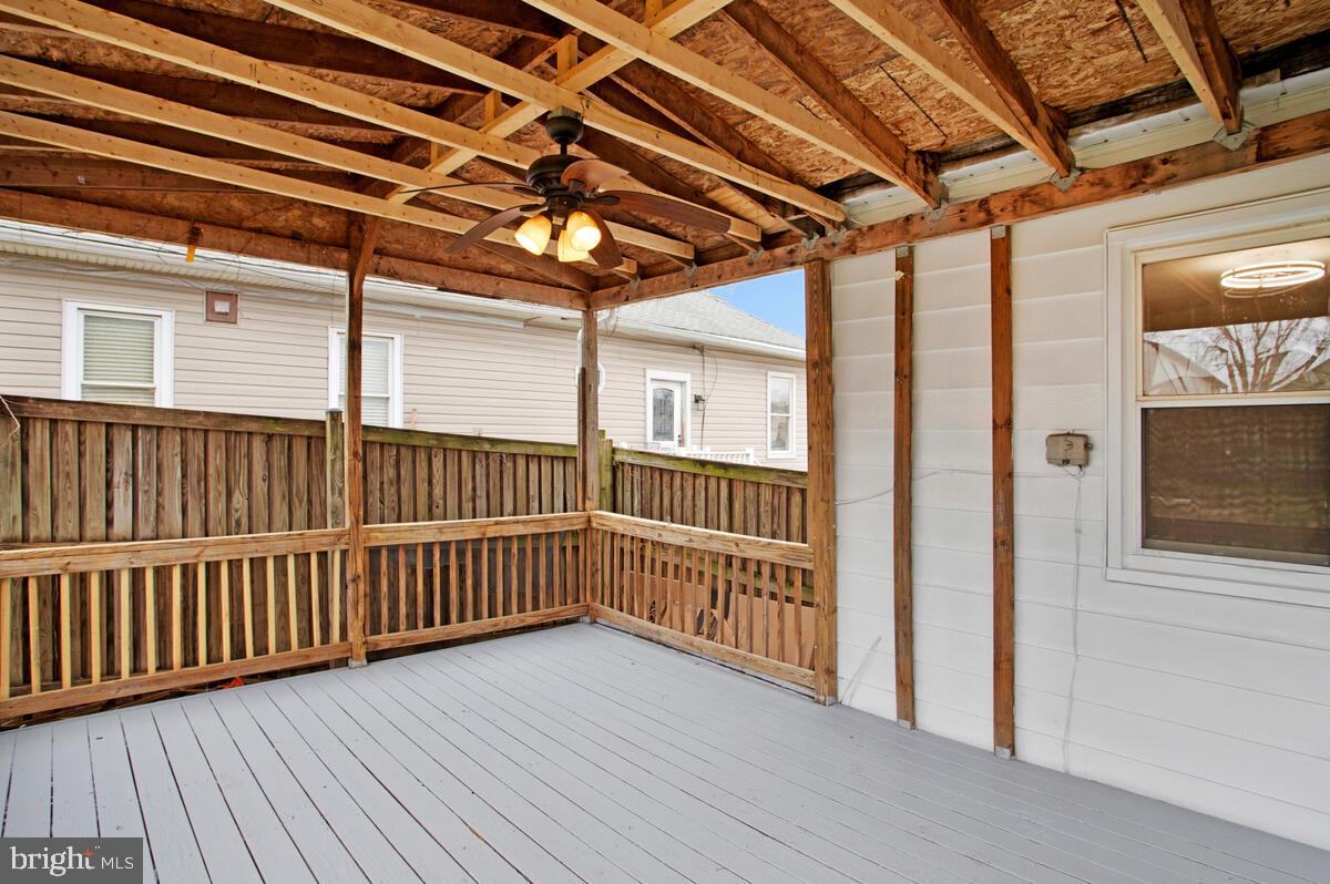 119 West Edgevale Road Baltimore, MD 21225 - Photo 34 of 37 a view of a porch with wooden floor