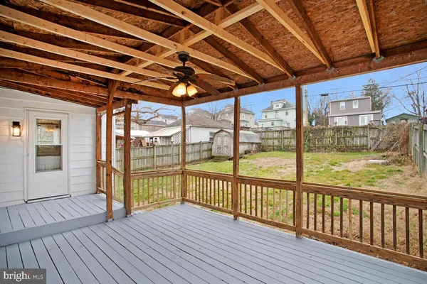 a view of a balcony with wooden floor