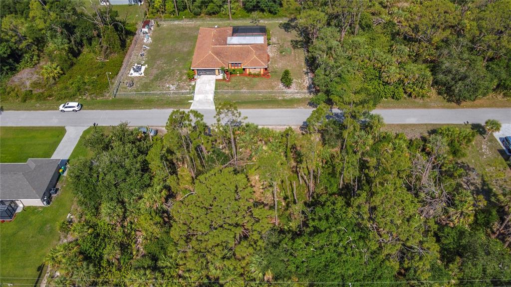 356 Lindon Street Port Charlotte, FL 33954 - Photo 16 of 18 an aerial view of residential house with outdoor space and trees all around