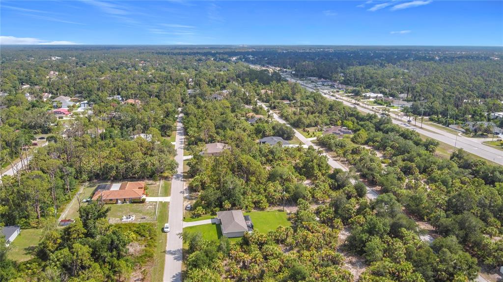 356 Lindon Street Port Charlotte, FL 33954 - Photo 18 of 18 an aerial view of residential building with green space