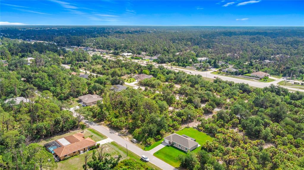 356 Lindon Street Port Charlotte, FL 33954 - Photo 4 of 18 an aerial view of residential houses with outdoor space and trees