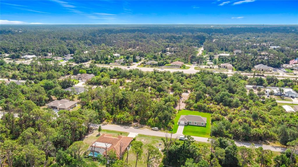 356 Lindon Street Port Charlotte, FL 33954 - Photo 5 of 18 an aerial view of residential houses with outdoor space and trees