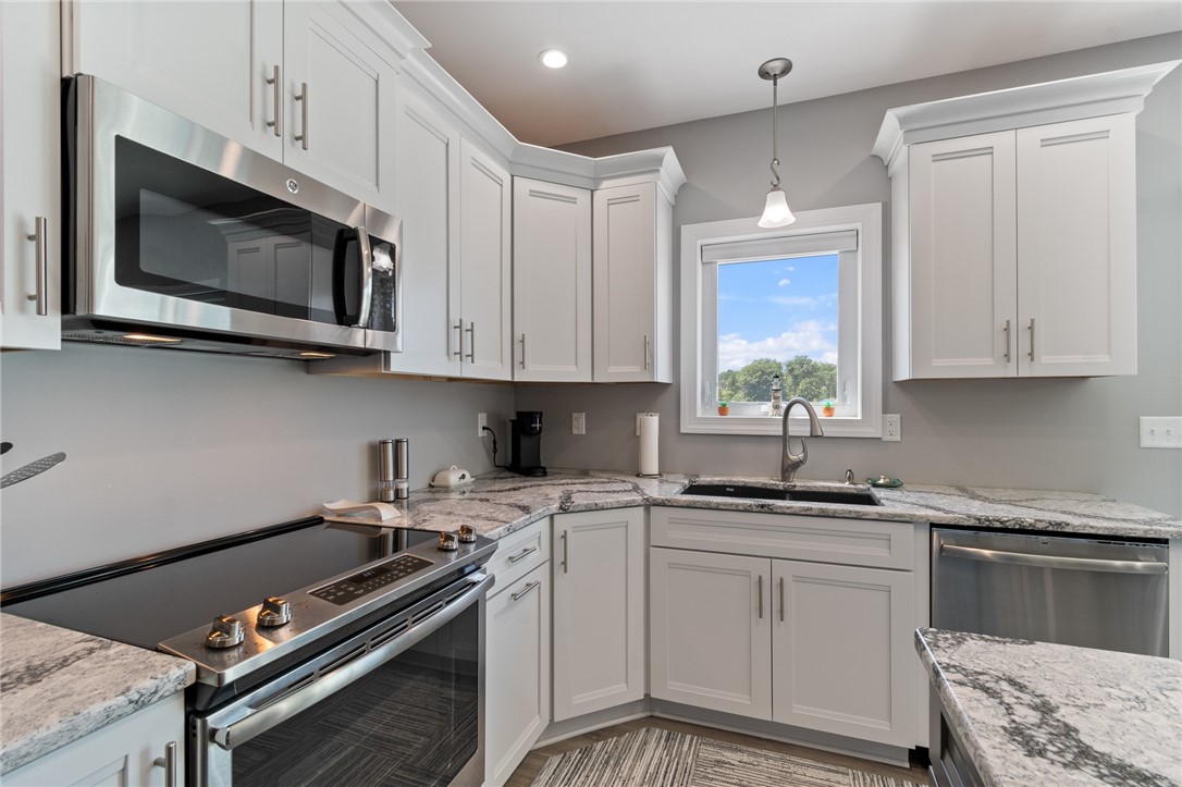 8249 Dogwood Road Huron, NY 14590 - Photo 6 of 33 Stn. stl. appl., Quartz counters, soft close cabin