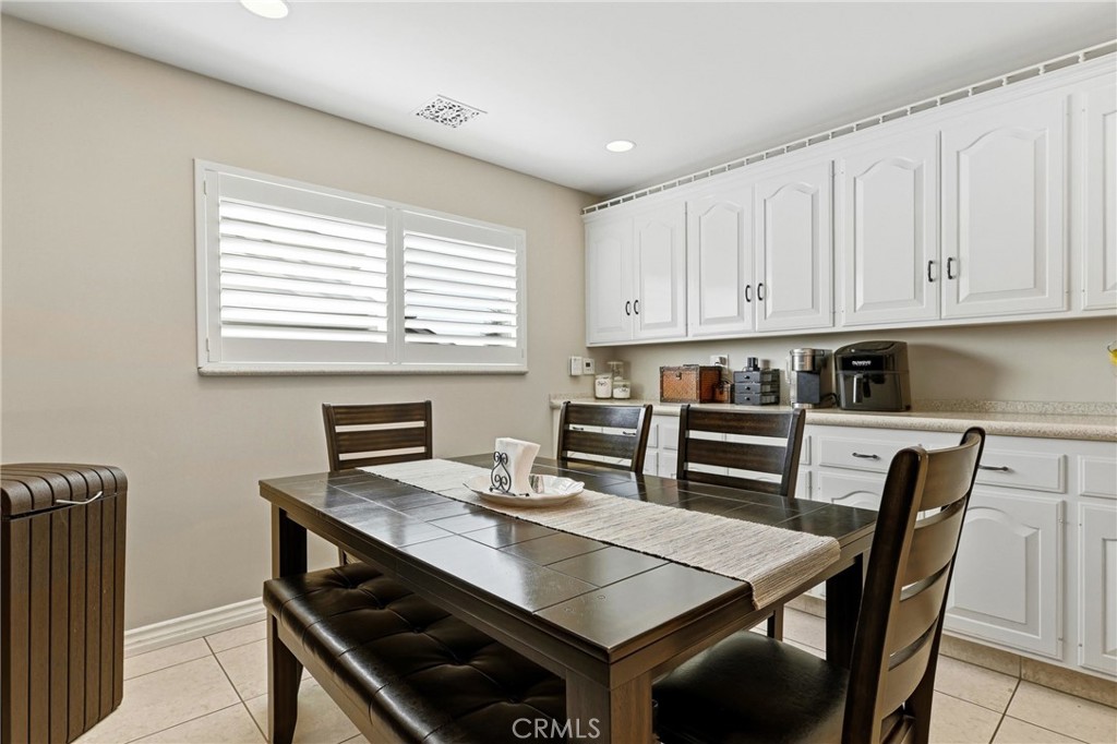 930 La Rue Avenue, Unit RUE La Verne, CA 91750 - Photo 12 of 63 a view of a kitchen with a table and chairs