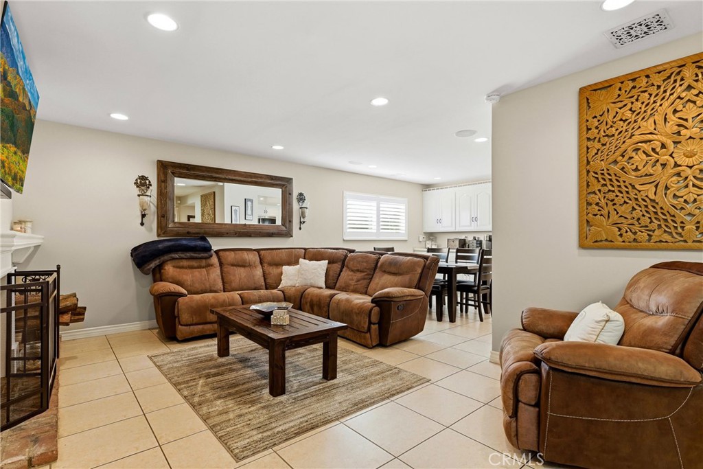 930 La Rue Avenue, Unit RUE La Verne, CA 91750 - Photo 18 of 63 a living room with furniture a rug and a painting