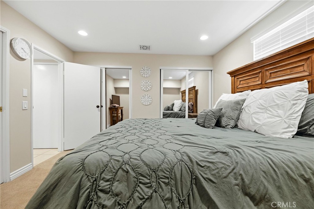 930 La Rue Avenue, Unit RUE La Verne, CA 91750 - Photo 30 of 63 a bedroom with a large bed and a chandelier