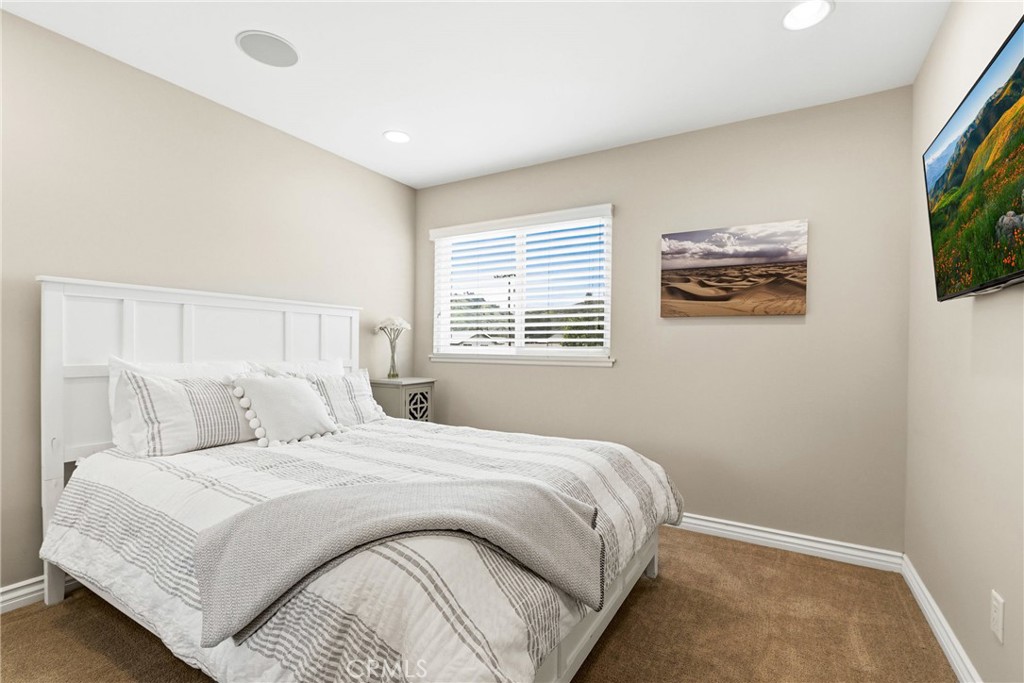 930 La Rue Avenue, Unit RUE La Verne, CA 91750 - Photo 33 of 63 a bedroom with a bed and a flat screen tv